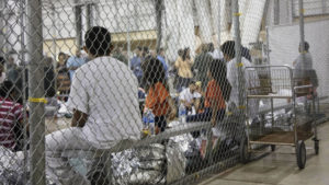 Children with families detained in cages at border.